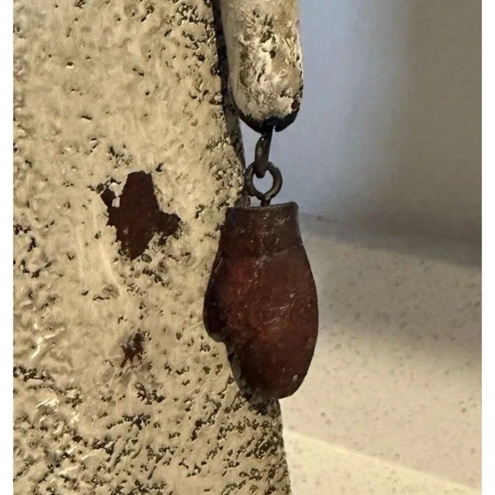 VTG decorative rustic metal sculpture of a stylized figure holding a large key.